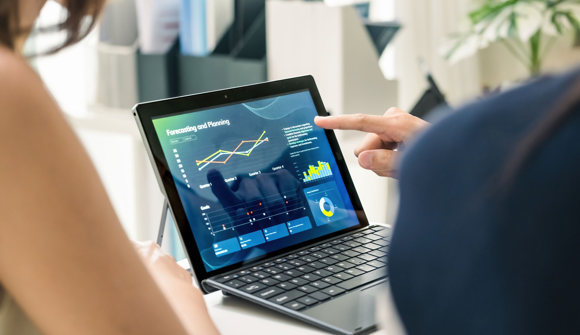 close up hand team of financial discussion fintech  technology planning, analyzing digital financial data and strategy in a modern office